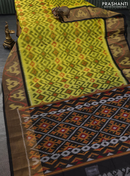 Ikat silk cotton saree lime yellow and black with allover ikat weaves and ikat woven zari border