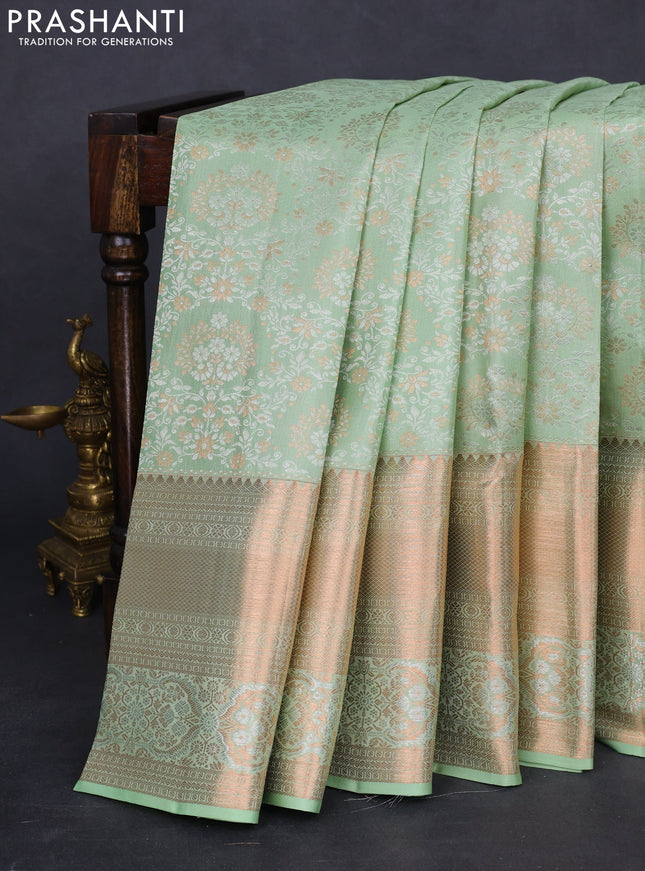 Pure kanchipuram silk saree pastel green shade with allover silver & gold zari woven brocade weaves and rich copper zari woven border