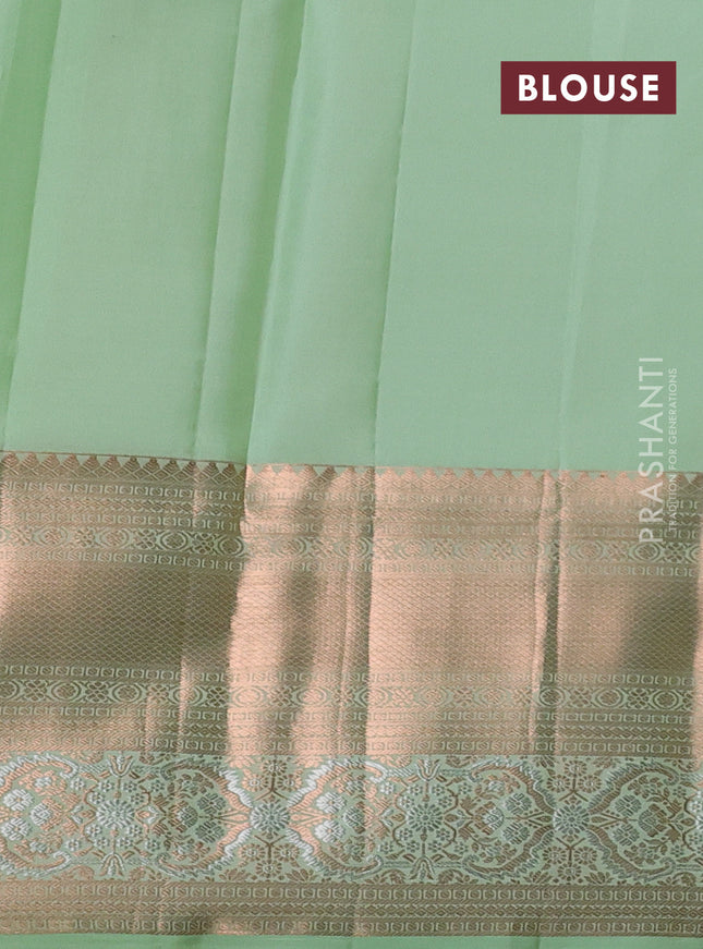 Pure kanchipuram silk saree pastel green shade with allover silver & gold zari woven brocade weaves and rich copper zari woven border