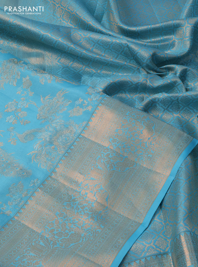 Pure kanchipuram silk saree light blue with allover zari woven peacock brocade weaves and rich zari woven border