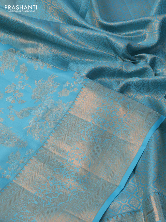 Pure kanchipuram silk saree light blue with allover zari woven peacock brocade weaves and rich zari woven border