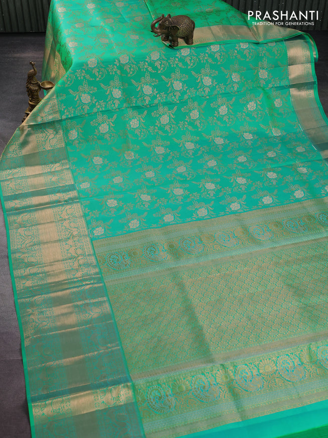 Pure kanchipuram silk saree teal green shade with allover zari woven floral brocade weaves and rich zari woven border