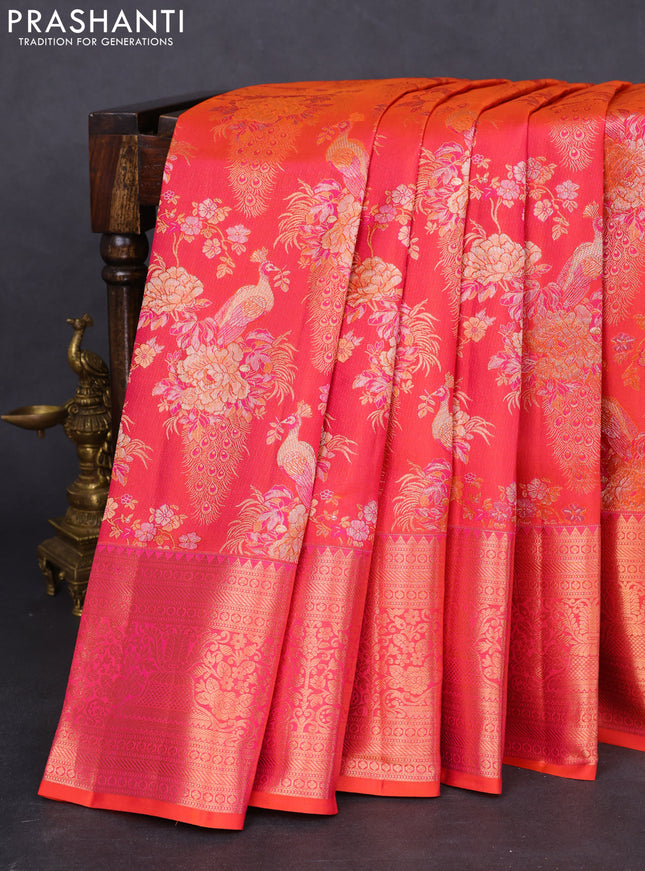 Pure kanchipuram silk saree dual shade of pinkish orange with allover zari woven peacock brocade weaves and rich zari woven border
