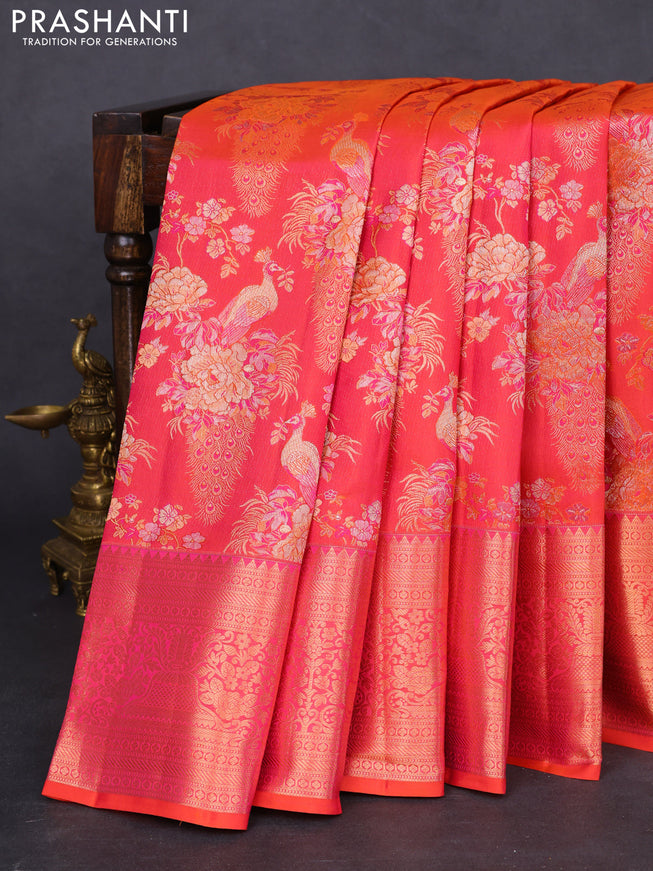 Pure kanchipuram silk saree dual shade of pinkish orange with allover zari woven peacock brocade weaves and rich zari woven border