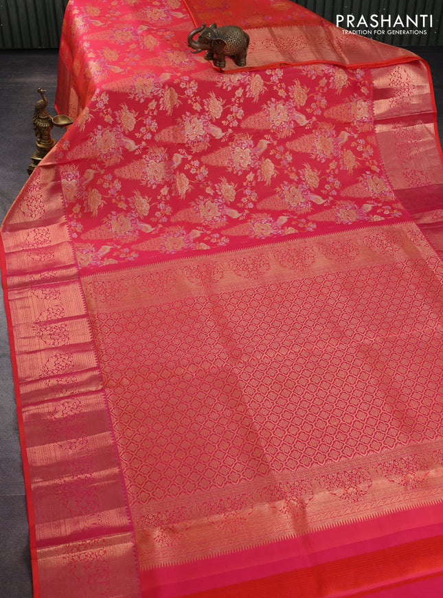 Pure kanchipuram silk saree dual shade of pinkish orange with allover zari woven peacock brocade weaves and rich zari woven border