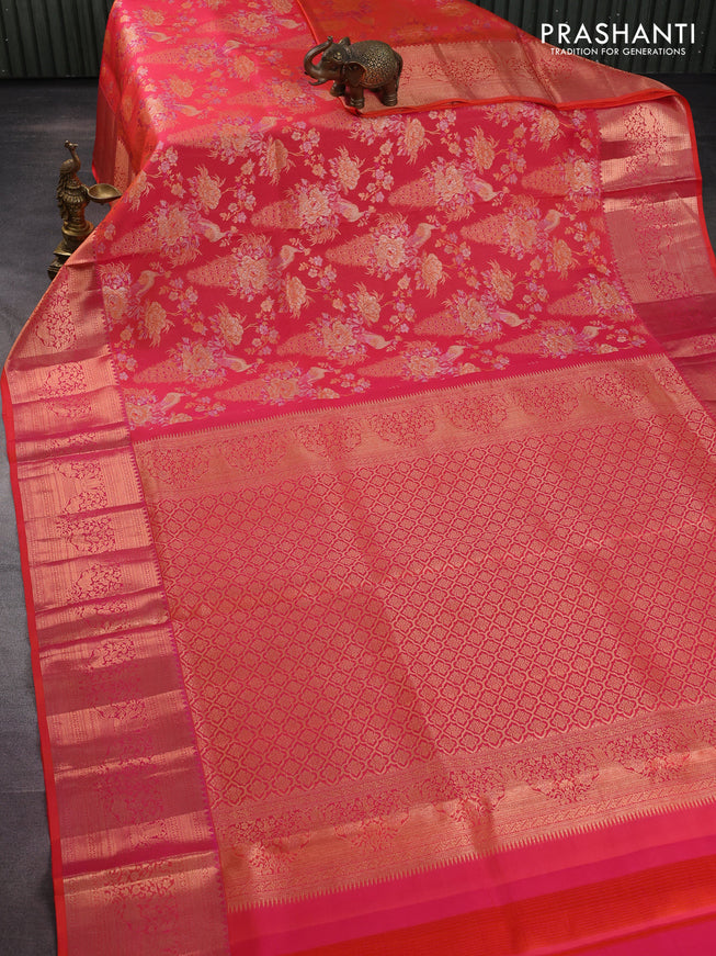 Pure kanchipuram silk saree dual shade of pinkish orange with allover zari woven peacock brocade weaves and rich zari woven border
