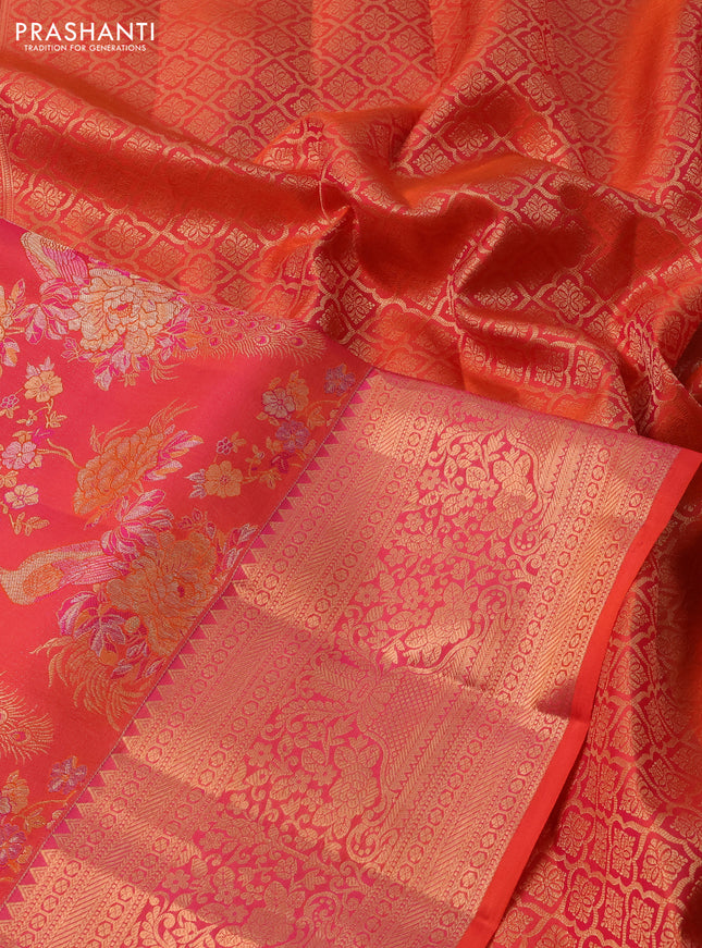 Pure kanchipuram silk saree dual shade of pinkish orange with allover zari woven peacock brocade weaves and rich zari woven border