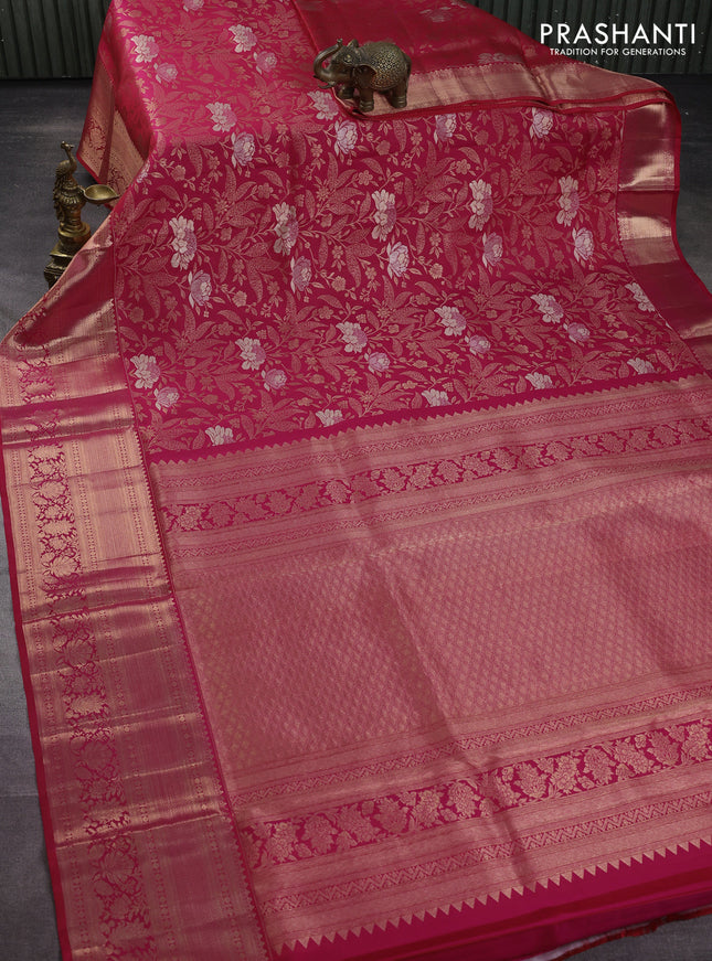 Pure kanchipuram silk saree dual shade of pinkish orange with allover zari woven floral brocade weaves and rich zari woven border