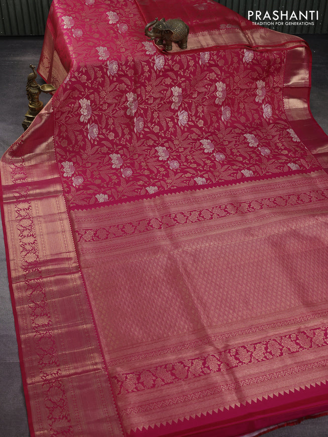 Pure kanchipuram silk saree dual shade of pinkish orange with allover zari woven floral brocade weaves and rich zari woven border
