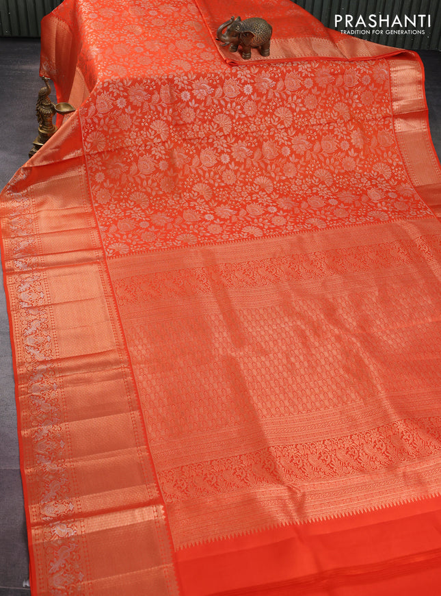 Pure kanchipuram silk saree orange with allover zari woven floral brocade weaves and rich zari woven border