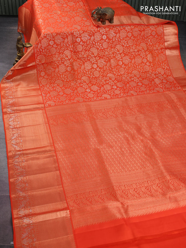 Pure kanchipuram silk saree orange with allover zari woven floral brocade weaves and rich zari woven border