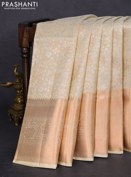 Pure kanchipuram silk saree cream with allover silver & gold zari woven floral brocade weaves and rich copper zari woven border
