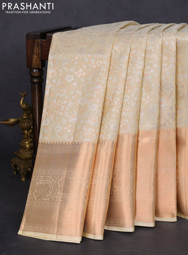 Pure kanchipuram silk saree cream with allover silver & gold zari woven floral brocade weaves and rich copper zari woven border