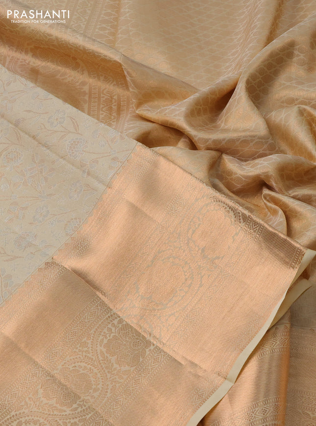 Pure kanchipuram silk saree cream with allover silver & gold zari woven floral brocade weaves and rich copper zari woven border