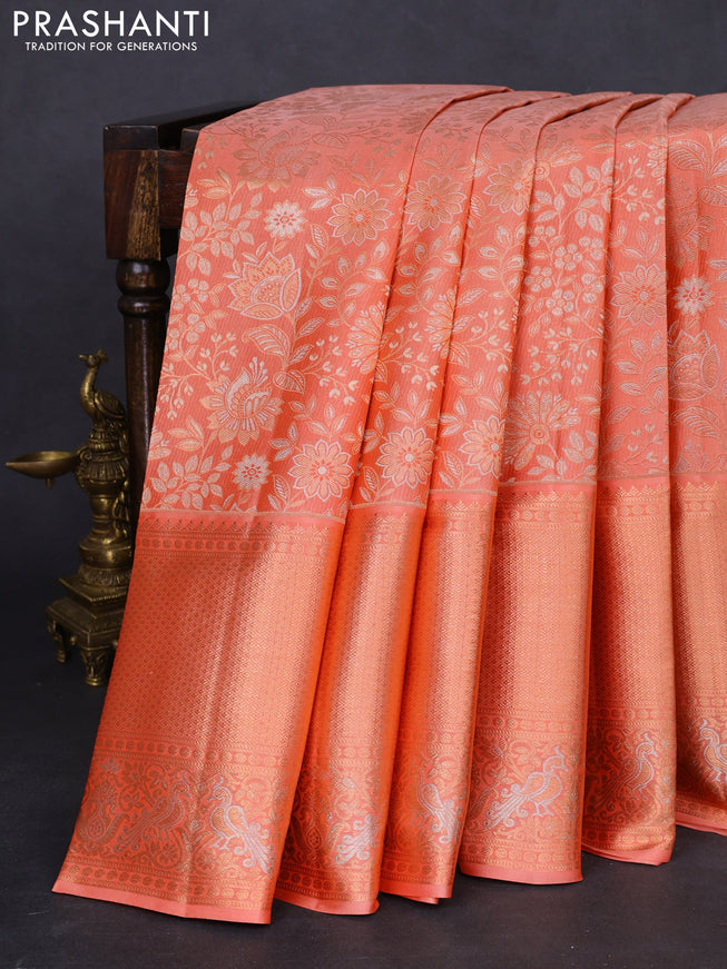 Pure kanchipuram silk saree pastel peach with allover zari woven floral brocade weaves and rich zari woven border