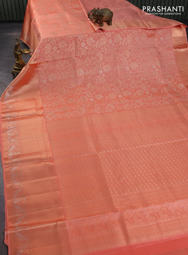 Pure kanchipuram silk saree pastel peach with allover zari woven floral brocade weaves and rich zari woven border