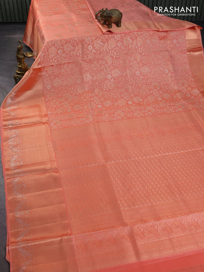 Pure kanchipuram silk saree pastel peach with allover zari woven floral brocade weaves and rich zari woven border