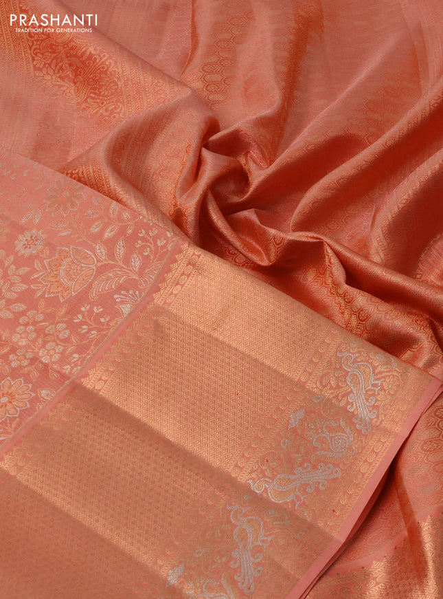 Pure kanchipuram silk saree pastel peach with allover zari woven floral brocade weaves and rich zari woven border