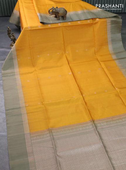 Pure soft silk saree mustard yellow and elaichi green with allover zari weaves & buttas and zari woven simple border