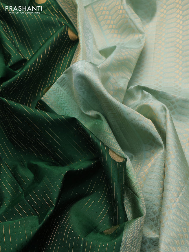 Pure soft silk saree green and pastel green with allover zari weaves and zari woven border