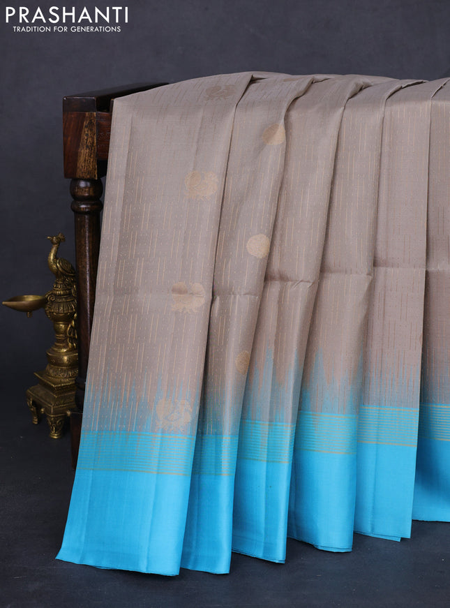 Pure soft silk saree grey and light blue with allover zari weaves and zari woven simple border