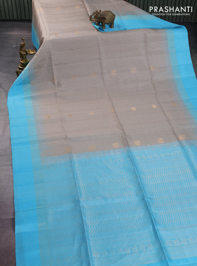 Pure soft silk saree grey and light blue with allover zari weaves and zari woven simple border