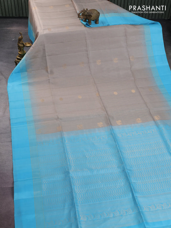 Pure soft silk saree grey and light blue with allover zari weaves and zari woven simple border