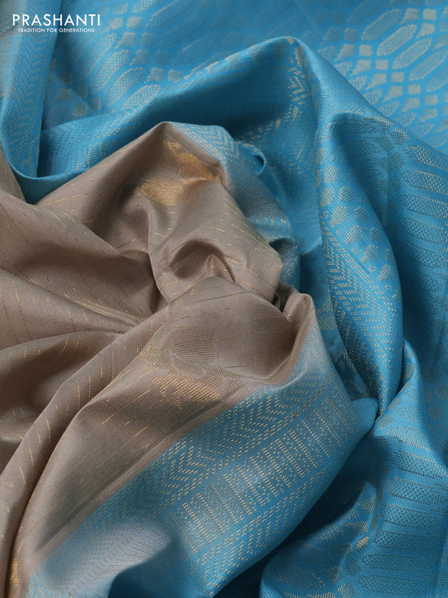 Pure soft silk saree grey and light blue with allover zari weaves and zari woven simple border