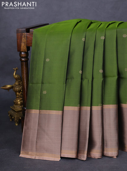 Pure soft silk saree sap green and pastel brown with zari woven floral buttas and rettapet zari woven border
