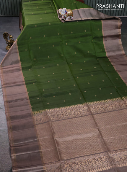 Pure soft silk saree sap green and pastel brown with zari woven floral buttas and rettapet zari woven border