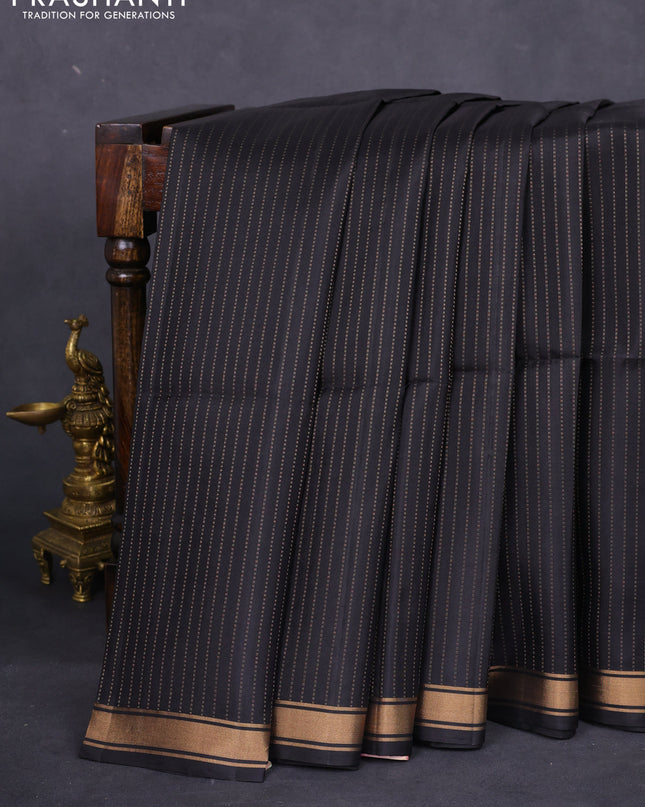 Pure soft silk saree black and pastel pink with allover zari weaves and zari woven border
