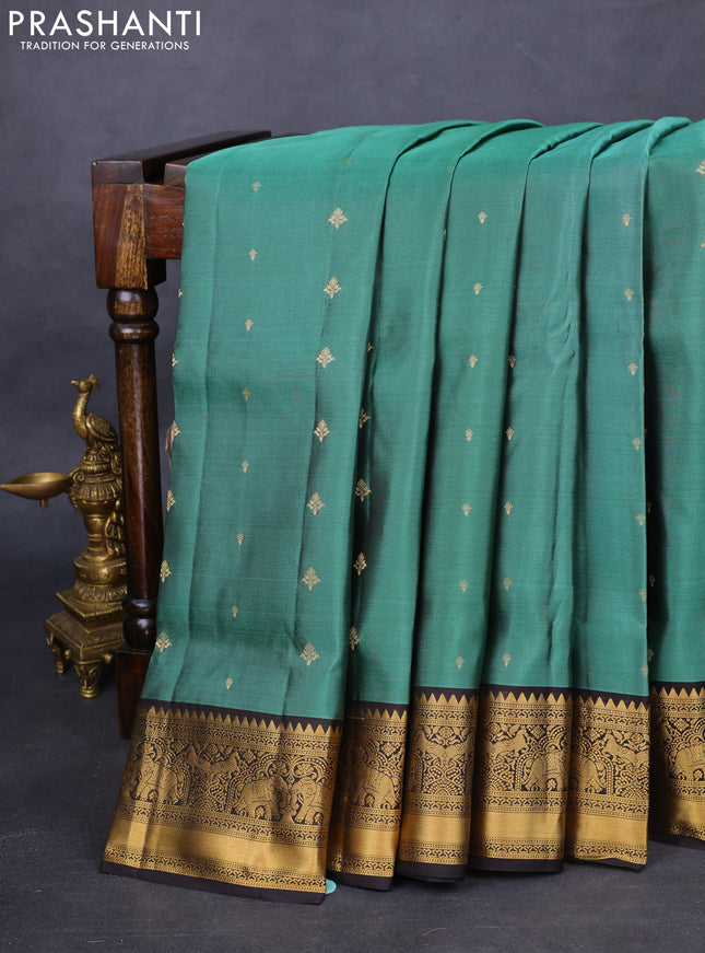 Pure soft silk saree pastel green and coffee brown with allover zari woven buttas and zari woven border
