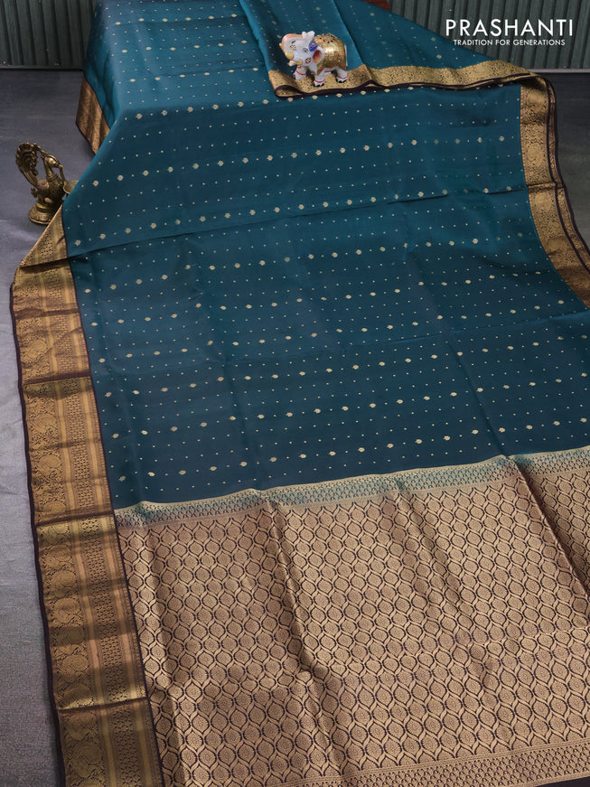 Pure soft silk saree peacock green and coffee brown with allover zari woven buttas and zari woven border