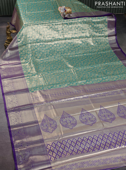 Bangalori tissue silk saree teal green shade and violet with allover zari woven brocade weaves and long zari woven border