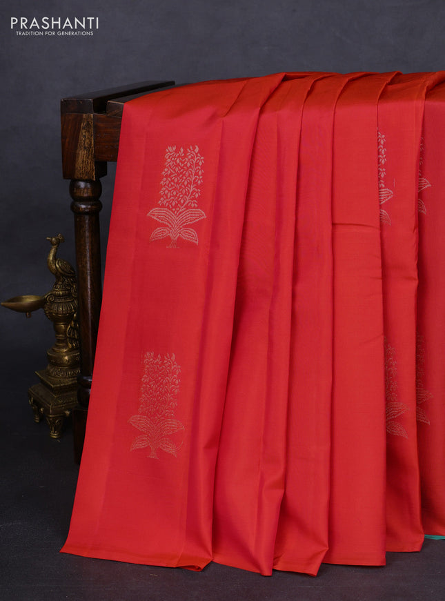 Kanchipuram silk saree dual shade of pinkish orange and teal green with copper zari woven buttas in borderless style