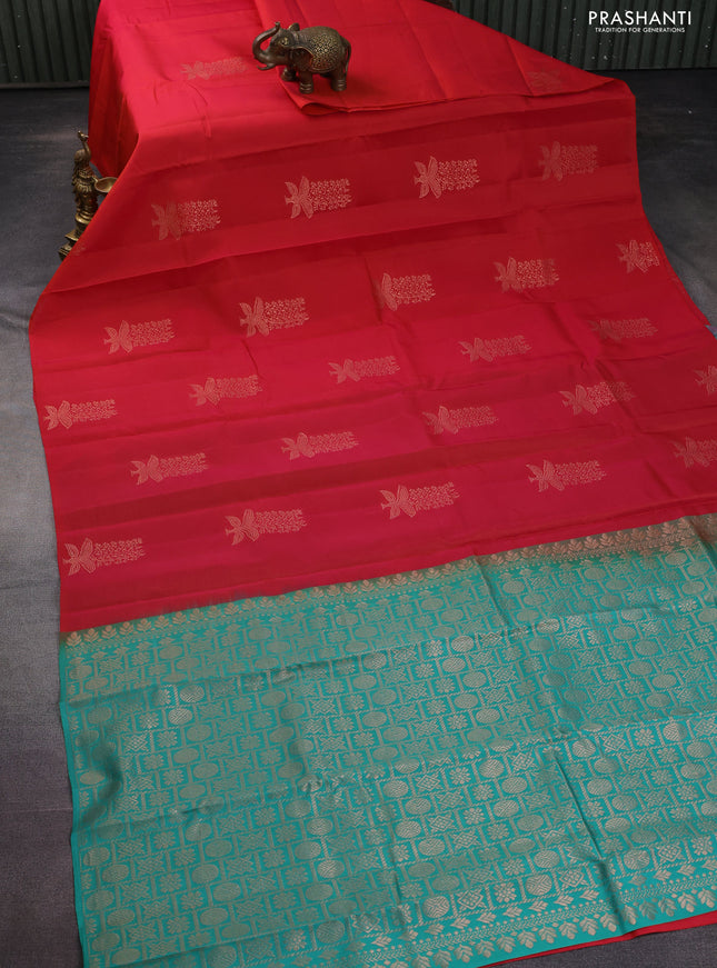 Kanchipuram silk saree dual shade of pinkish orange and teal green with copper zari woven buttas in borderless style