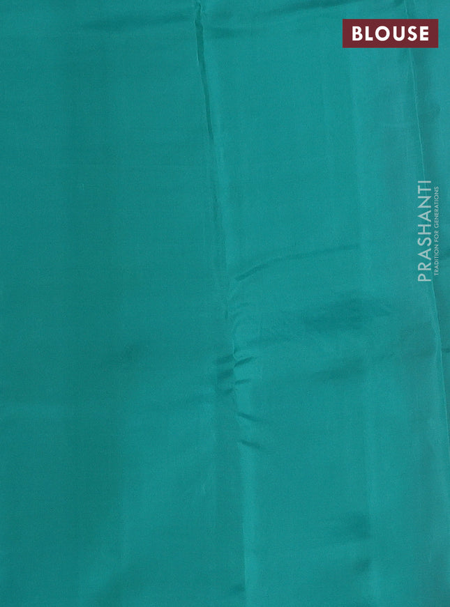 Kanchipuram silk saree dual shade of pinkish orange and teal green with copper zari woven buttas in borderless style