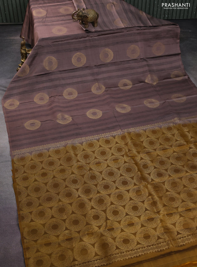 Kanchipuram silk saree pastel brown and dark mustard with zari woven buttas & jute finish in borderless style