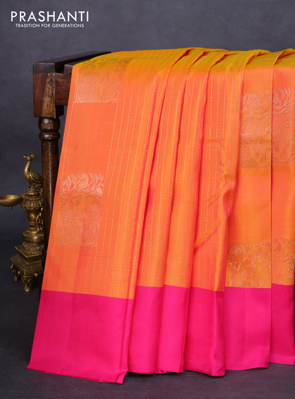 Kanchipuram silk saree dual shade of yellowish pink and pink with allover zari weaves & buttas and simple border