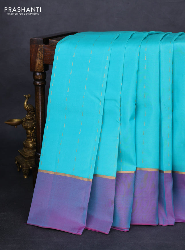 Kanchipuram silk saree teal blue and dual shade of purple with allover zari woven temple buttas and zari woven simple border