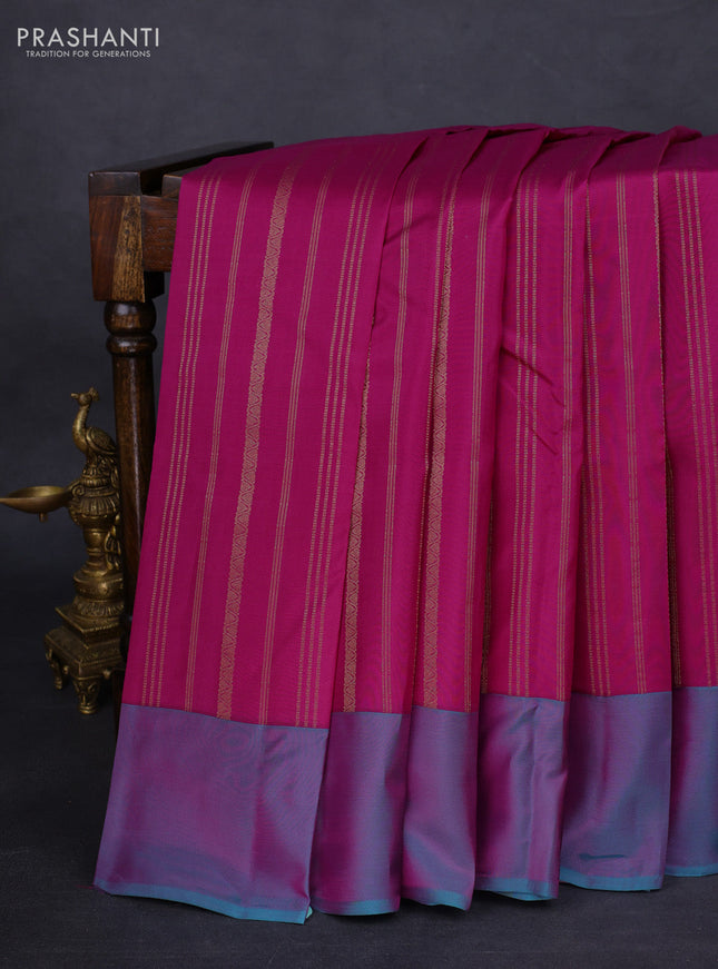 Kanchipuram silk saree dark magenta pink and dual shade of teal blue with allover zari weaves and simple border