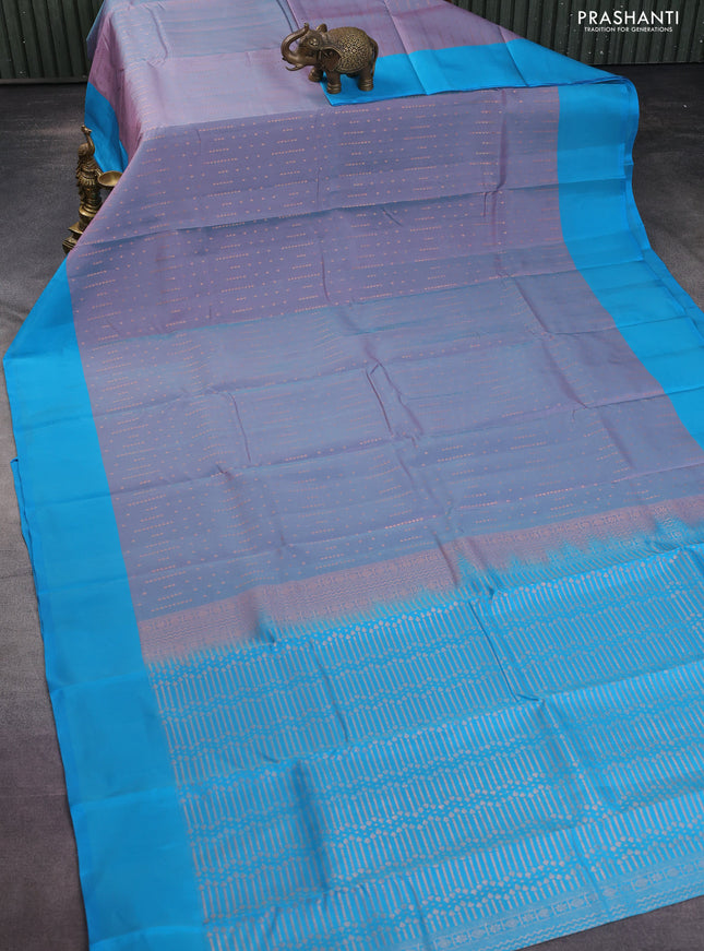Kanchipuram silk saree dual shade of greyish pink and teal blue with allover copper zari woven butta weaves and simple border