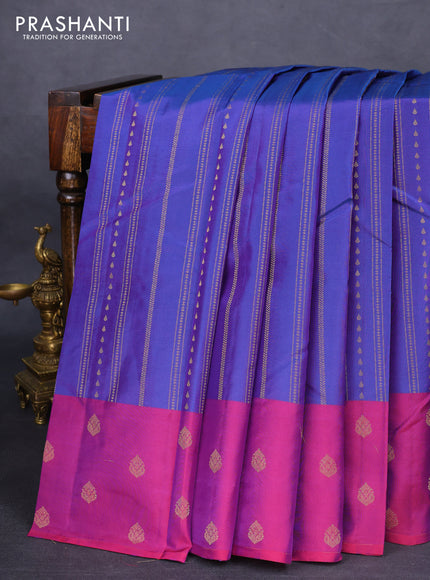 Kanchipuram silk saree dual shade of blue and magenta pink with allover zari weaves and zari woven butta border
