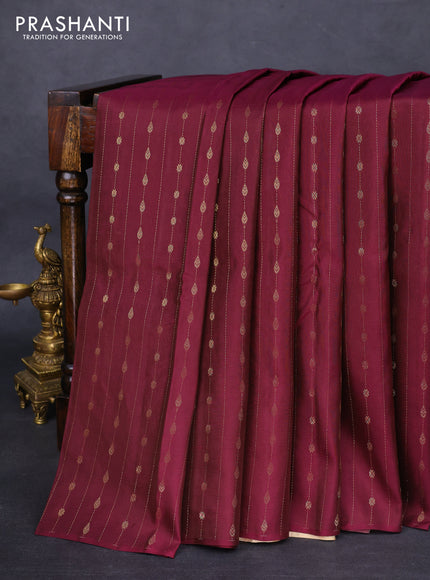 Kanchipuram silk saree wine shade and cream with allover zari weaves in borderless style