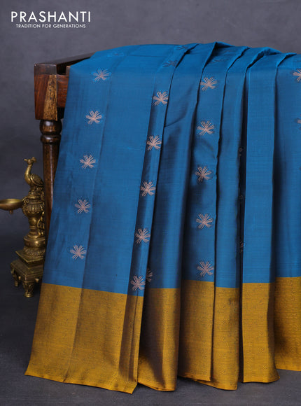 Kanchipuram silk saree peacock blue and dark mustard with zari woven buttas and self emboss border