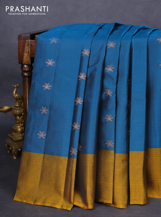 Kanchipuram silk saree peacock blue and dark mustard with zari woven buttas and self emboss border
