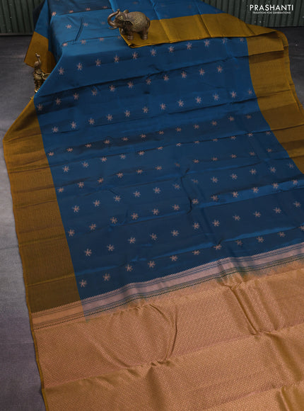 Kanchipuram silk saree peacock blue and dark mustard with zari woven buttas and self emboss border