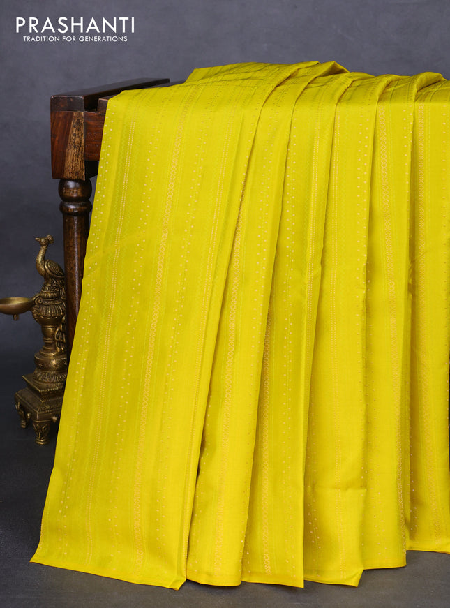 Kanchipuram silk saree lime yellow and bottle green with allover zari weaves & self emboss in borderless style