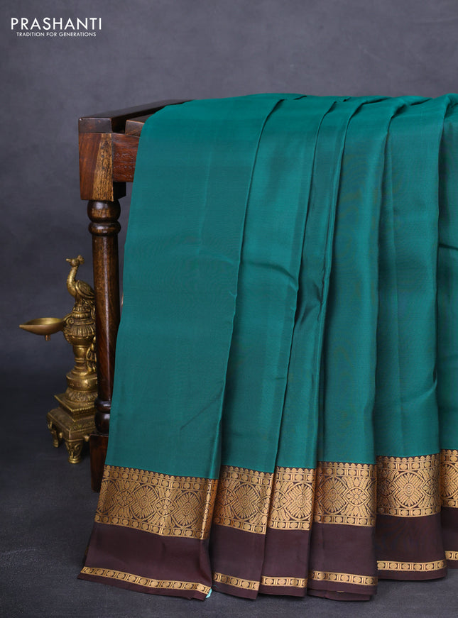 Kanchipuram silk saree green and brown with plain body and rettapet zari woven border