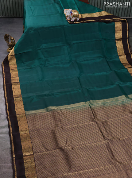 Kanchipuram silk saree green and brown with plain body and rettapet zari woven border